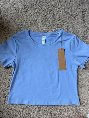 New Acta baby tee